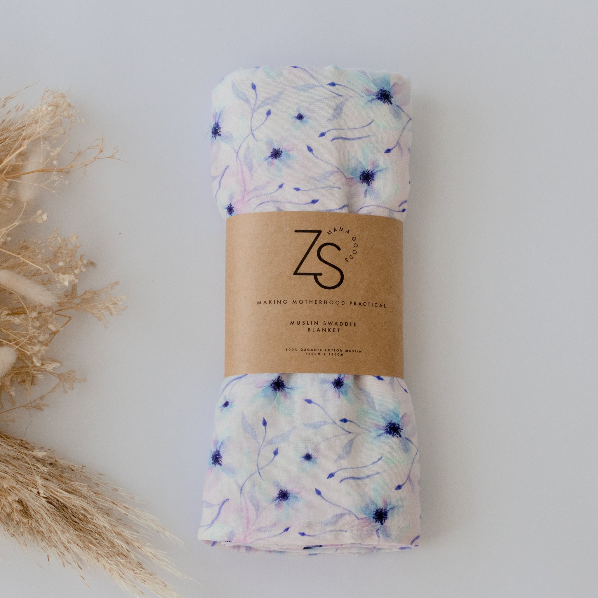 Organic cotton muslin swaddle wrap in twilight bloom floral print by Zoe Sage