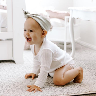 Chambray baby top knot headband flat lay displayed by Zoe Sage