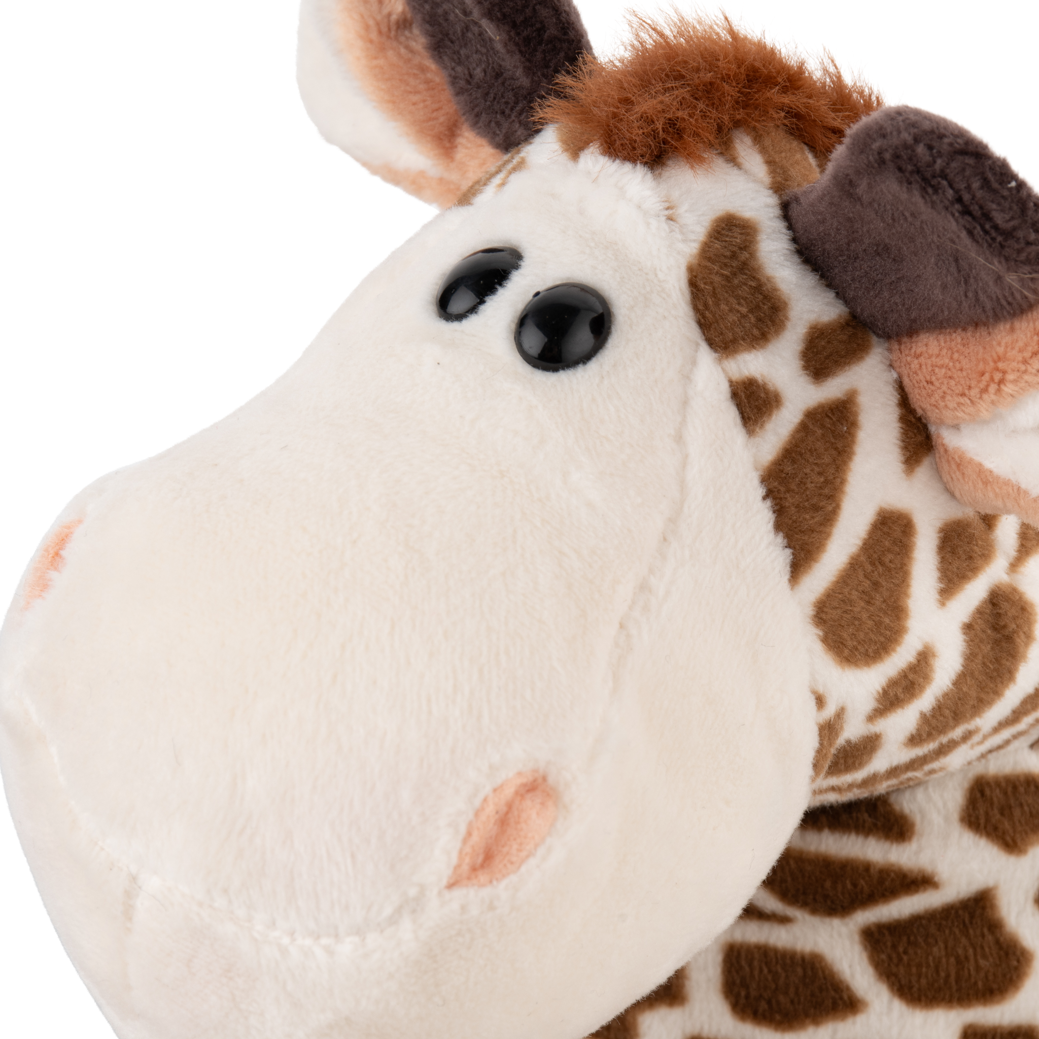 Soft plush giraffe toy Eddie shown from side angle in warm tan color