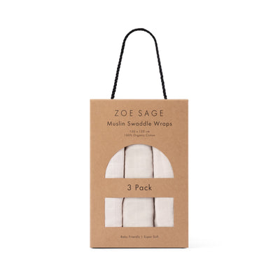 Three folded organic cotton muslin swaddles in oat colour by Zoe Sage
