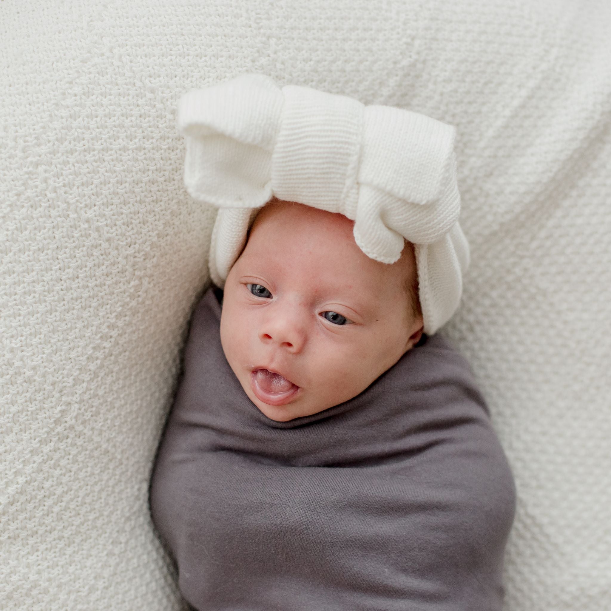 Stretchy baby swaddle wrap in storm grey organic cotton fabric