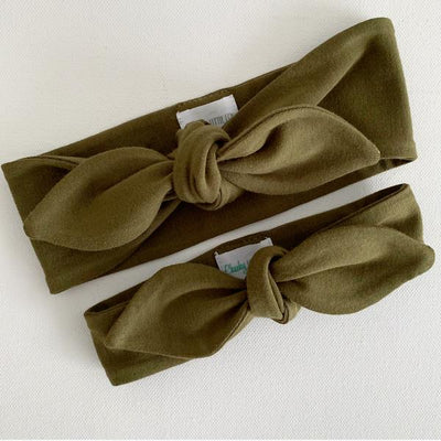 Olive green baby top knot headband flat lay by Zoe Sage