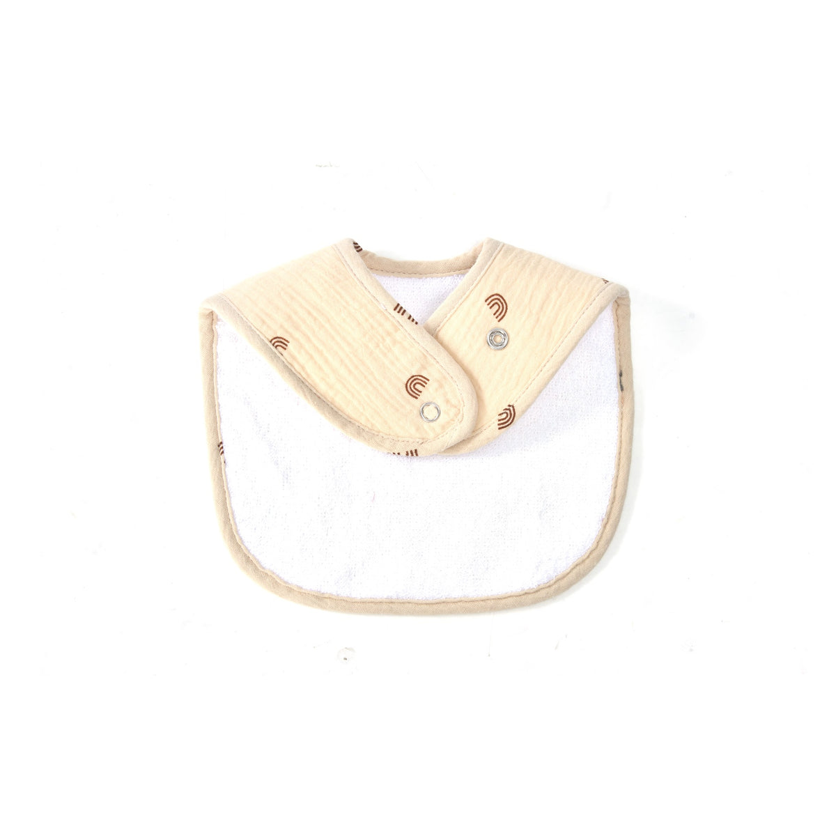 Organic muslin baby bib fastened at the neck showing the snap closure