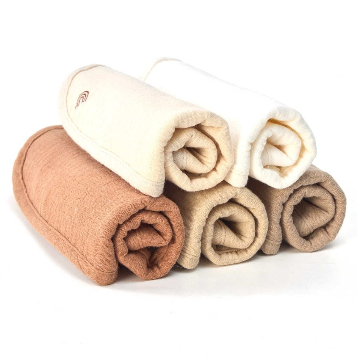 Five organic muslin baby bibs rolled and stacked in Dusty Dunes colours