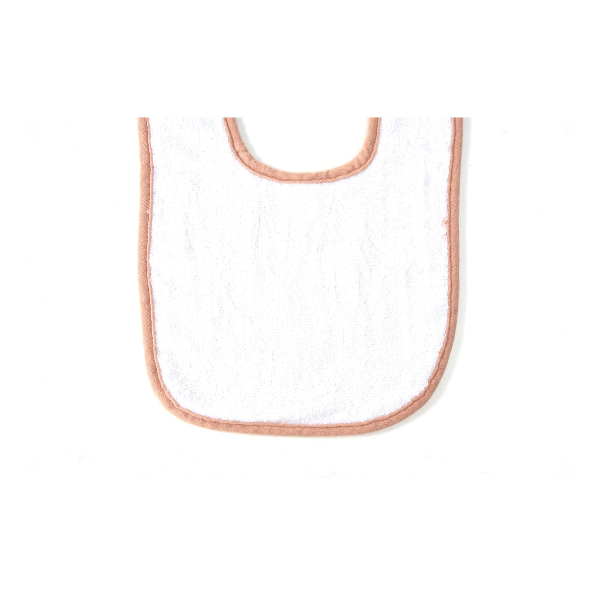 Back of a muslin baby bib showing the soft white terry towelling and adjustable snaps