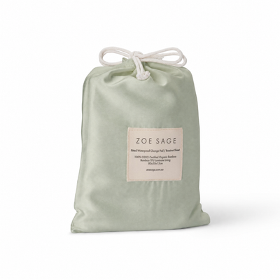 Sage waterproof bassinet sheet and change pad cover in its drawstring storage bag, Zoe Sage