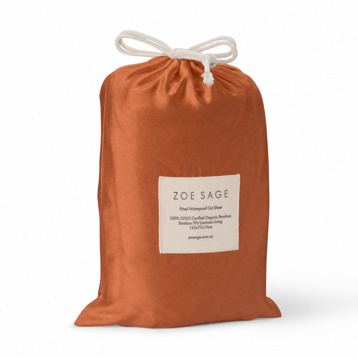 Savannah Rust waterproof fitted cot sheet in its drawstring storage bag, Zoe Sage