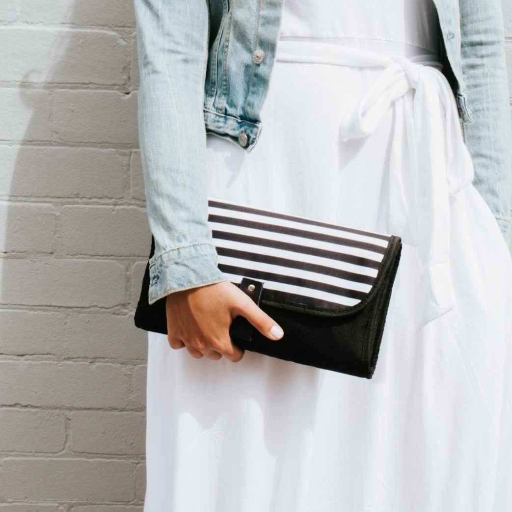 Women showing Nappy Change Mat Clutch | Zebra Crossing