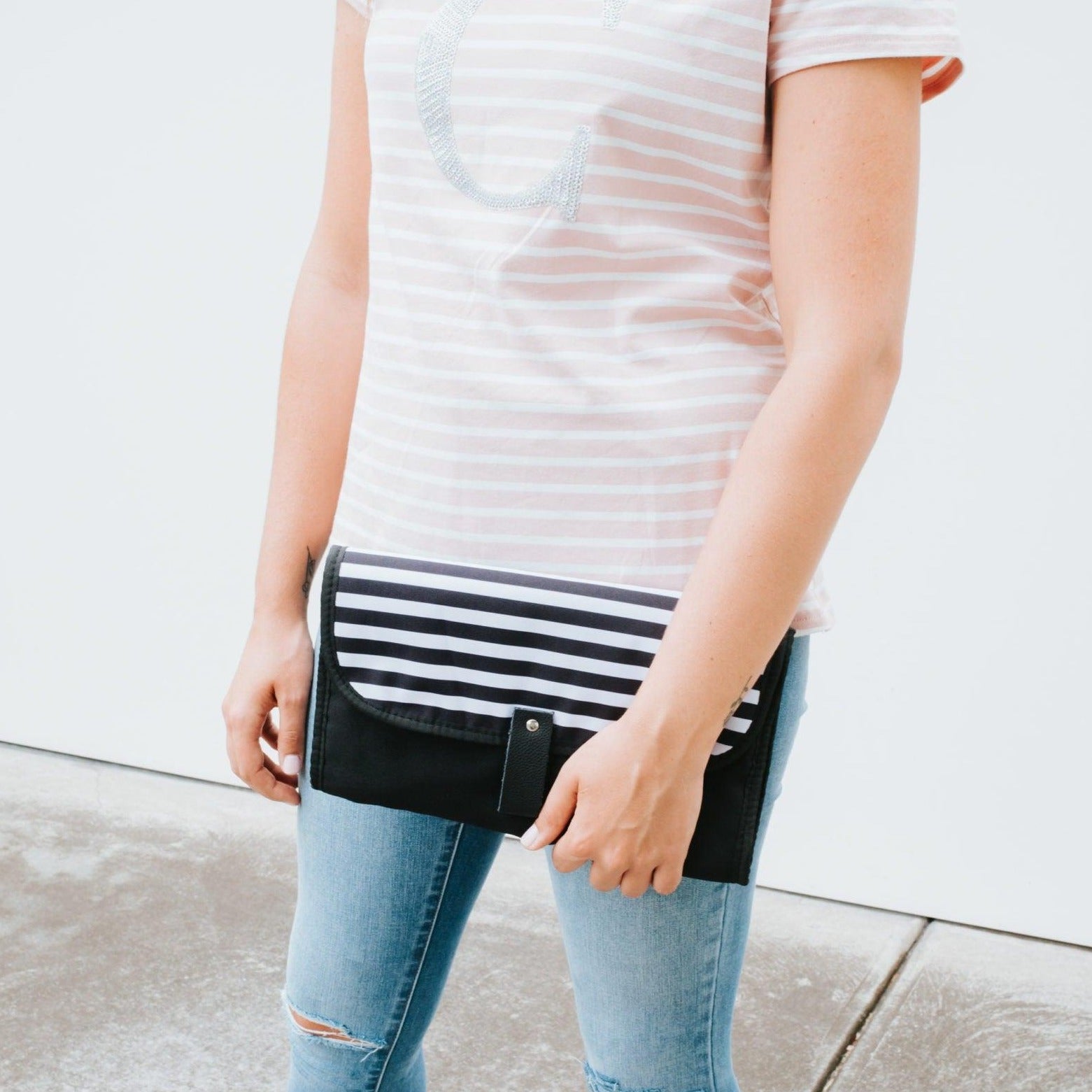 Women showing Nappy Change Mat Clutch | Zebra Crossing